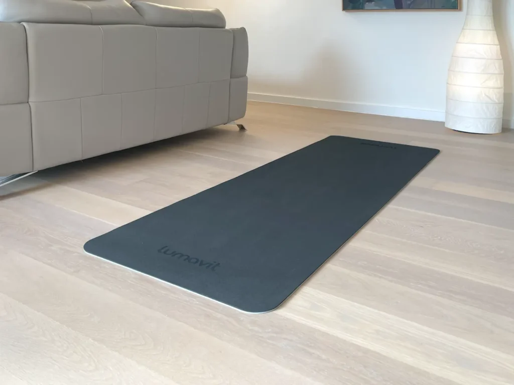 Lumavit mat placed behind a couch in a living room